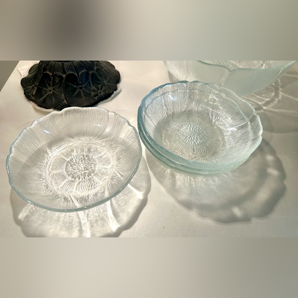 4 Arcoroc Fleur dishes. 5.75”